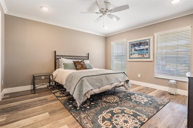 25601 Hutcheson Ln, Sorrento, FL 32776 - bedroom with crown molding, light wood finished floors, recessed lighting, and baseboards