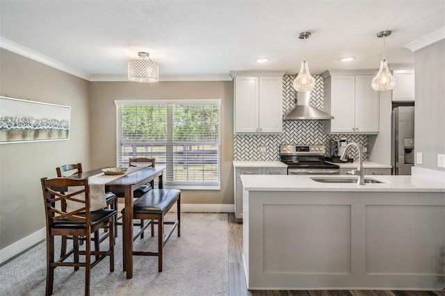 25601 Hutcheson Ln, Sorrento, FL 32776 - kitchen featuring baseboards, stainless steel appliances, wall chimney range hood, and a sink