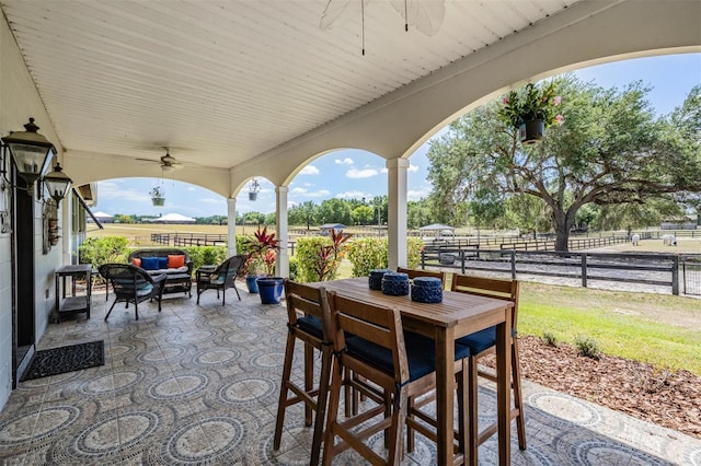 25601 Hutcheson Ln, Sorrento, FL 32776 - view of patio featuring an outdoor living space, ceiling fan, outdoor dining area, and fence