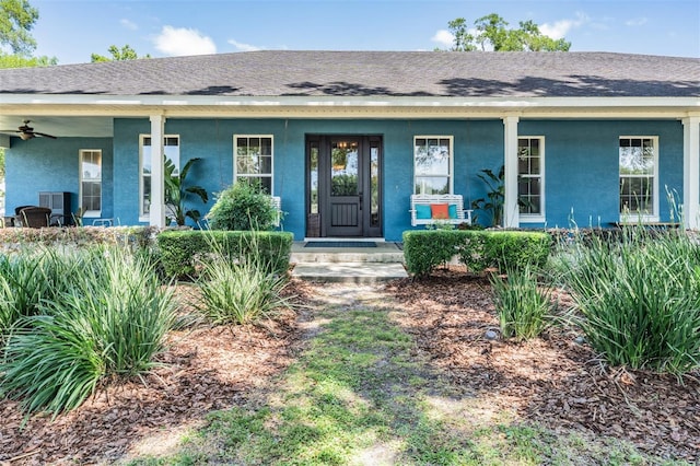 25601 Hutcheson Ln, Sorrento, FL 32776 - view of front of property with covered porch, a shingled roof, and stucco siding