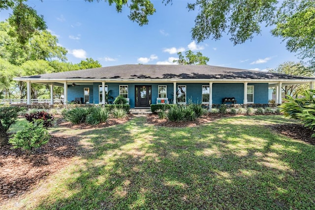 25601 Hutcheson Ln, Sorrento, FL 32776 - view of front facade featuring covered porch and a front yard