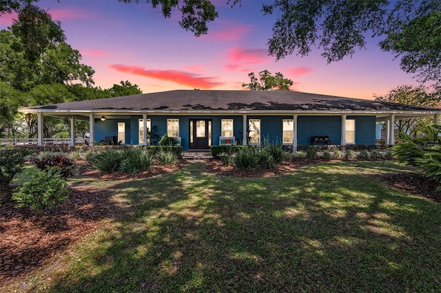 25601 Hutcheson Ln, Sorrento, FL 32776 - view of front of house with covered porch and a front lawn