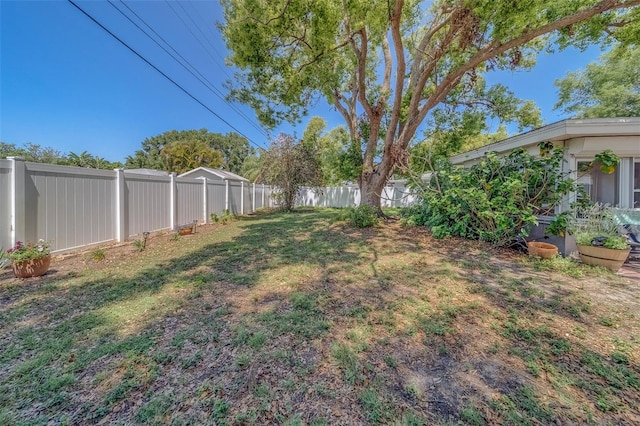 view of yard with a fenced backyard
