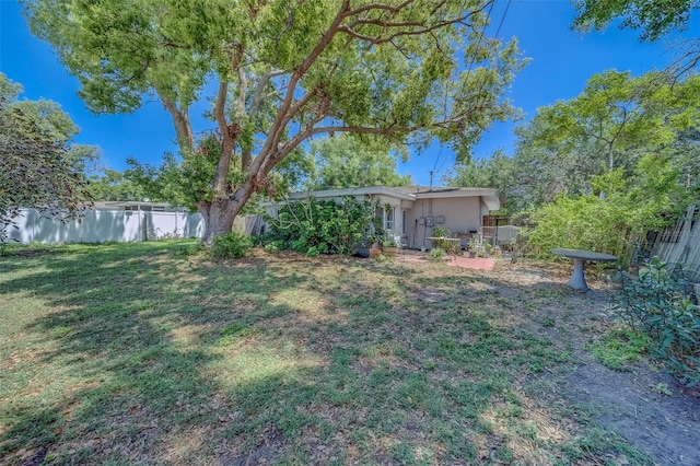 view of yard with a fenced backyard