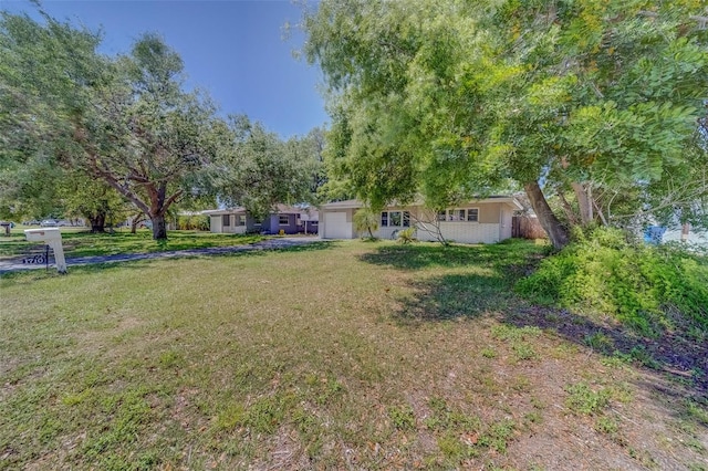 view of yard featuring a garage