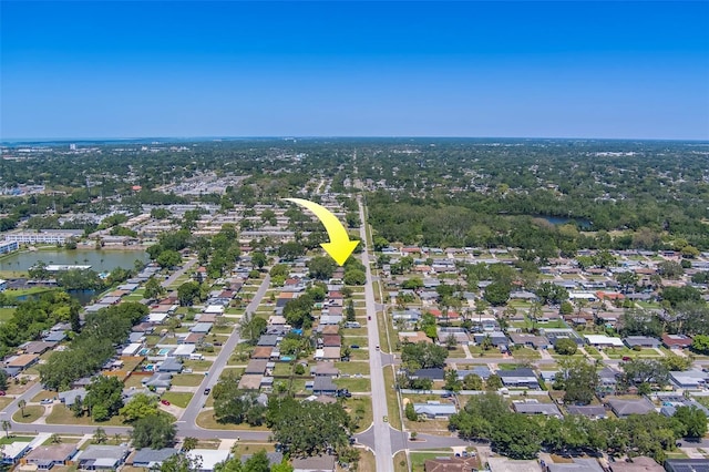 bird's eye view featuring a water view and a residential view