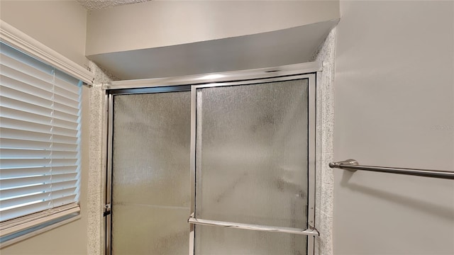 bathroom with an enclosed shower