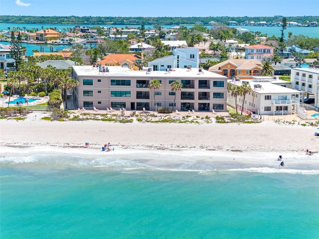 drone / aerial view with a water view and a view of the beach