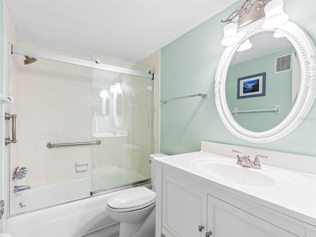 bathroom with shower / bath combination with glass door, vanity, visible vents, and toilet