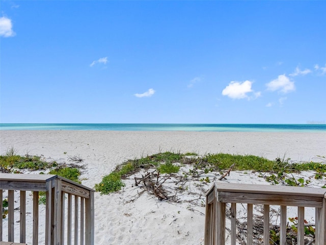 property view of water featuring a beach view
