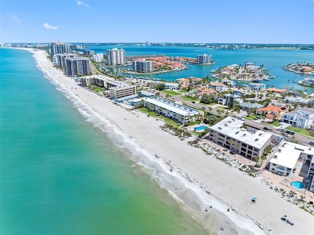 aerial view with a view of the beach and a water view