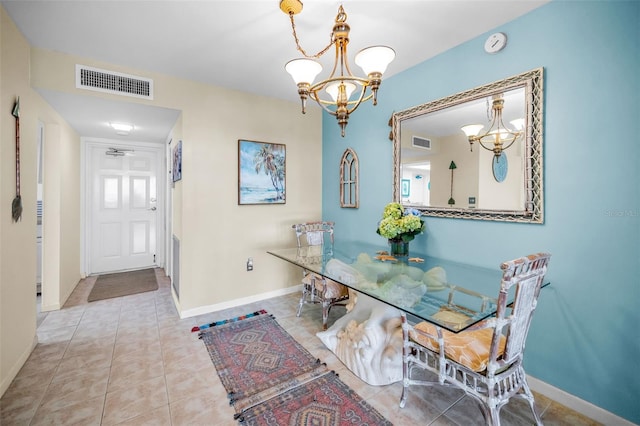 5108 Brittany Dr S Unit 607, Saint Petersburg, FL 33715 - tiled dining area featuring a chandelier and baseboards