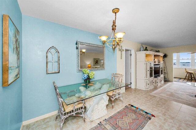 5108 Brittany Dr S Unit 607, Saint Petersburg, FL 33715 - dining room featuring a chandelier