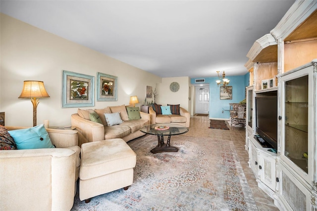 5108 Brittany Dr S Unit 607, Saint Petersburg, FL 33715 - living area with baseboards and a chandelier