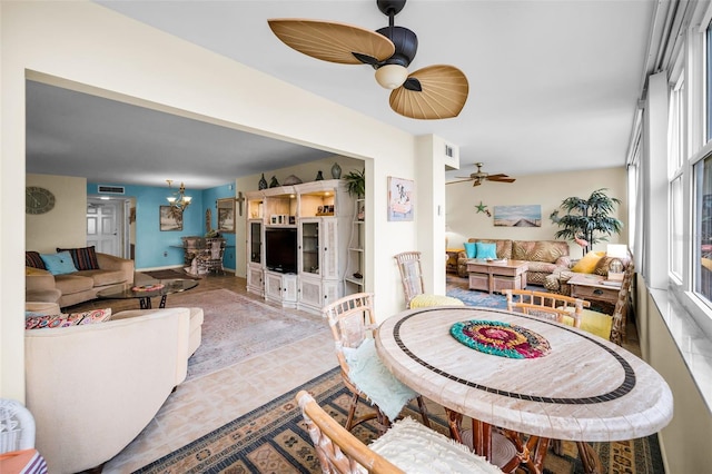5108 Brittany Dr S Unit 607, Saint Petersburg, FL 33715 - living room featuring a ceiling fan and a chandelier