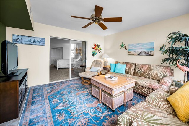 5108 Brittany Dr S Unit 607, Saint Petersburg, FL 33715 - living area featuring a ceiling fan and carpet flooring