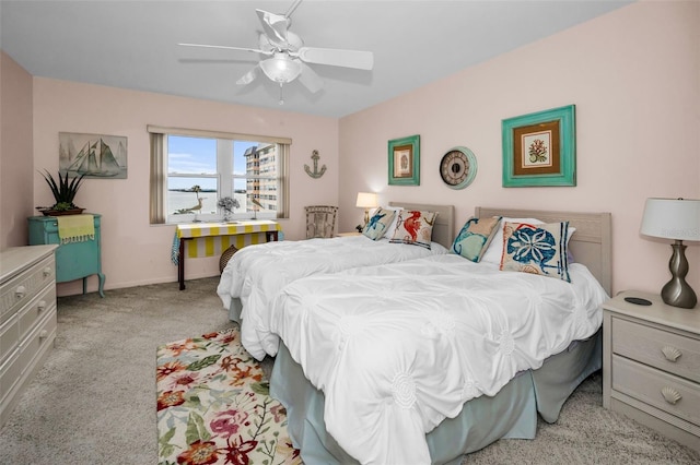 5108 Brittany Dr S Unit 607, Saint Petersburg, FL 33715 - carpeted bedroom with baseboards and ceiling fan