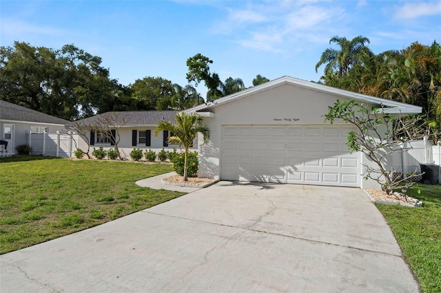 1698 Eden Ct, Clearwater, FL 33756 - single story home featuring a garage, concrete driveway, fence, a front yard, and stucco siding