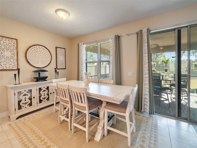 dining area with light tile patterned floors