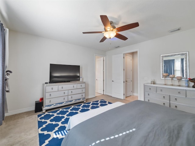 bedroom featuring carpet floors, visible vents, baseboards, and ceiling fan