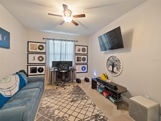 carpeted office space with ceiling fan
