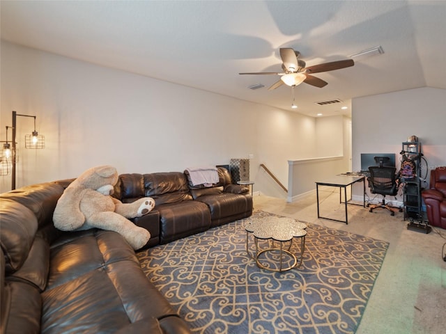carpeted living room with visible vents and ceiling fan