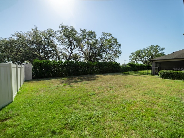 view of yard featuring fence