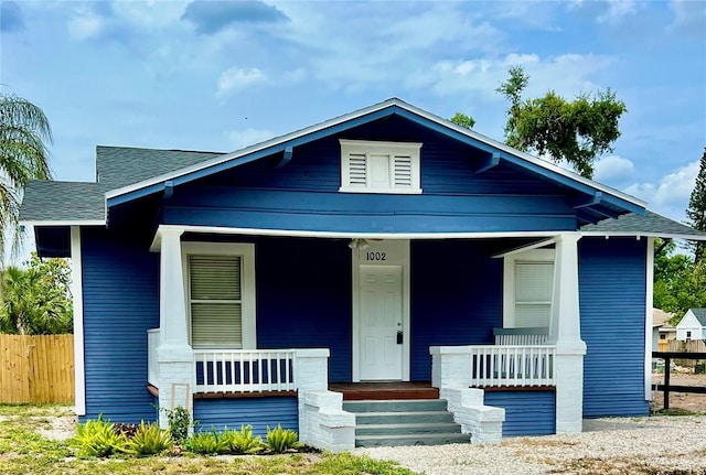 1002 E N Bay St, Tampa, FL 33603 - view of front of property with covered porch and a shingled roof