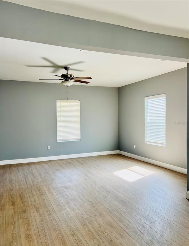 1002 E N Bay St, Tampa, FL 33603 - spare room featuring ceiling fan, light wood finished floors, and baseboards