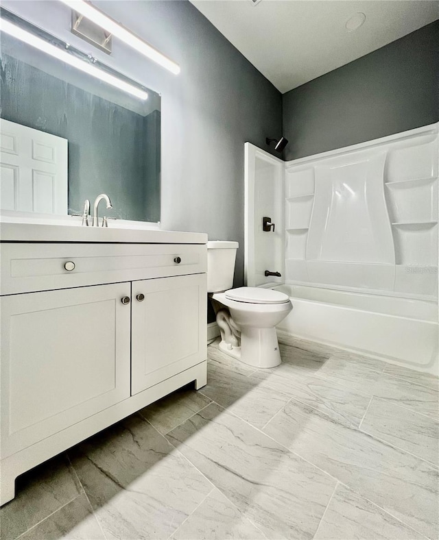1002 E N Bay St, Tampa, FL 33603 - bathroom featuring vanity, shower / tub combination, toilet, and marble finish flooring