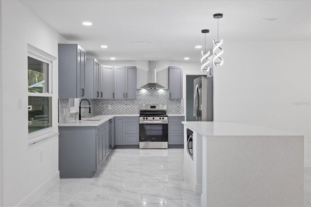 4175 N Concord Dr, Crystal River, FL 34428 - kitchen featuring tasteful backsplash, wall chimney exhaust hood, a sink, appliances with stainless steel finishes, and gray cabinets