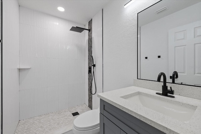4175 N Concord Dr, Crystal River, FL 34428 - full bathroom featuring visible vents, toilet, tiled shower, and vanity