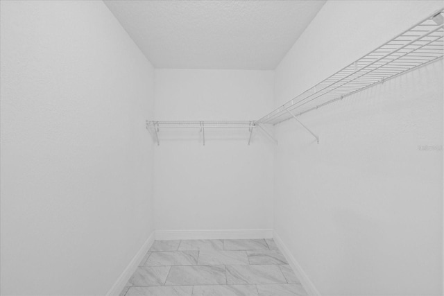 4175 N Concord Dr, Crystal River, FL 34428 - walk in closet featuring marble finish floor