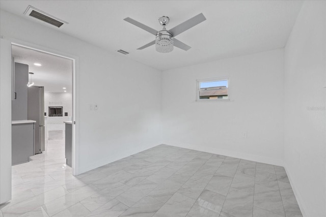 4175 N Concord Dr, Crystal River, FL 34428 - empty room featuring visible vents, baseboards, a ceiling fan, and marble finish floor