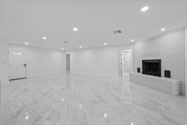 4175 N Concord Dr, Crystal River, FL 34428 - unfurnished living room featuring visible vents, recessed lighting, marble finish floor, and a fireplace