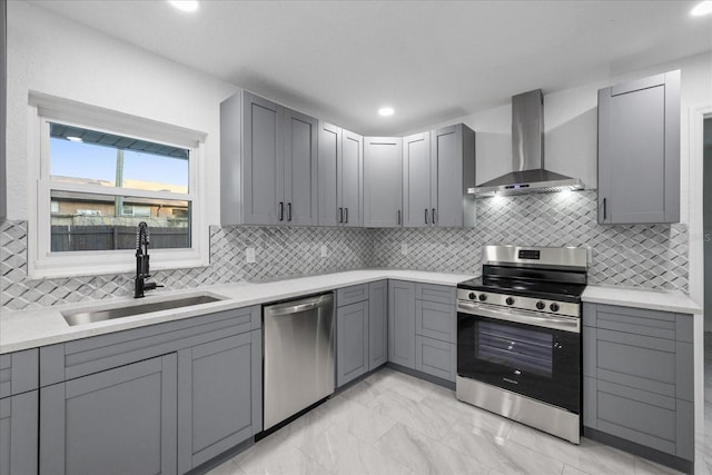 4175 N Concord Dr, Crystal River, FL 34428 - kitchen with wall chimney range hood, gray cabinetry, stainless steel appliances, and a sink