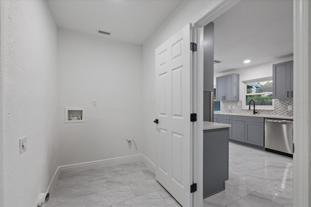 4175 N Concord Dr, Crystal River, FL 34428 - washroom with baseboards, washer hookup, a sink, laundry area, and marble finish floor