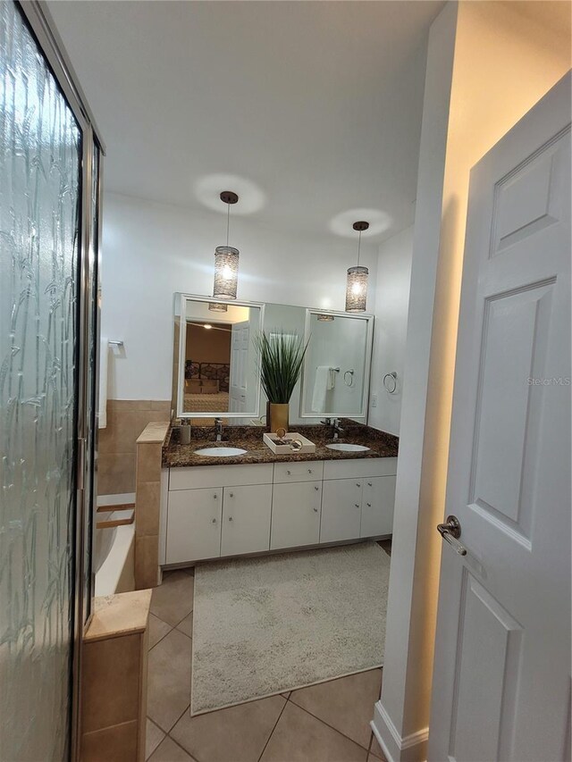824 Greenbelt Cir, Brandon, FL 33510 - full bathroom with tile patterned flooring, a bathtub, and double vanity
