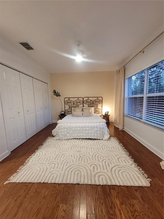 824 Greenbelt Cir, Brandon, FL 33510 - bedroom with wood finished floors, a ceiling fan, and a closet