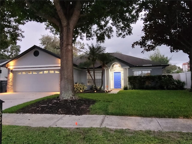 824 Greenbelt Cir, Brandon, FL 33510 - ranch-style home with an attached garage, driveway, and stucco siding