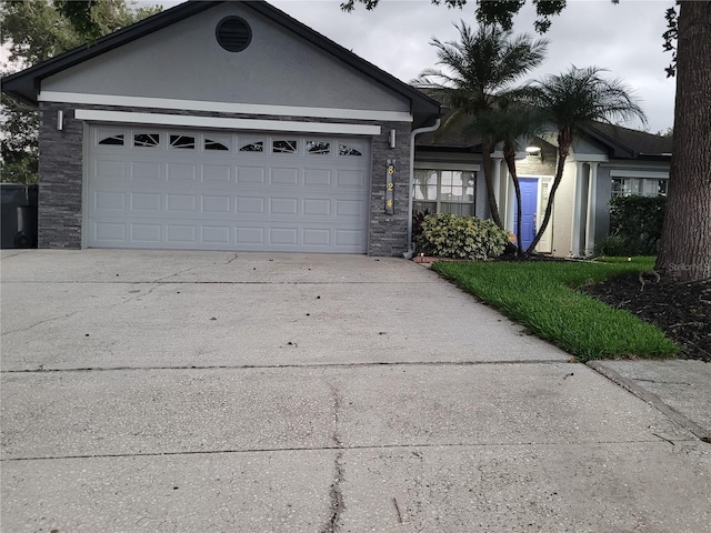 824 Greenbelt Cir, Brandon, FL 33510 - ranch-style home featuring concrete driveway and a garage