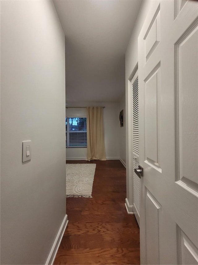 824 Greenbelt Cir, Brandon, FL 33510 - corridor featuring baseboards and dark wood-type flooring