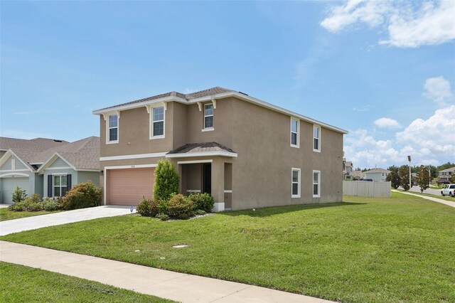 7530 Broad Pointe Dr, Zephyrhills, FL 33540 - view of front of house with stucco siding, a garage, and driveway