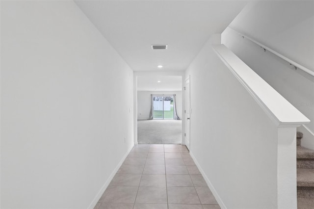 7530 Broad Pointe Dr, Zephyrhills, FL 33540 - hallway featuring light tile patterned floors, recessed lighting, and stairway