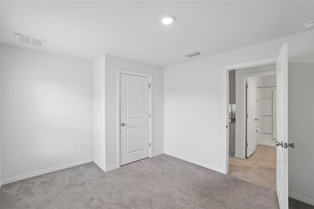 7530 Broad Pointe Dr, Zephyrhills, FL 33540 - unfurnished bedroom featuring carpet flooring and baseboards