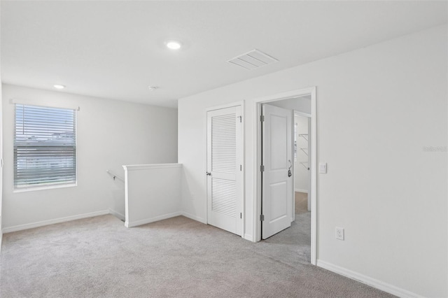 7530 Broad Pointe Dr, Zephyrhills, FL 33540 - carpeted empty room featuring baseboards and recessed lighting
