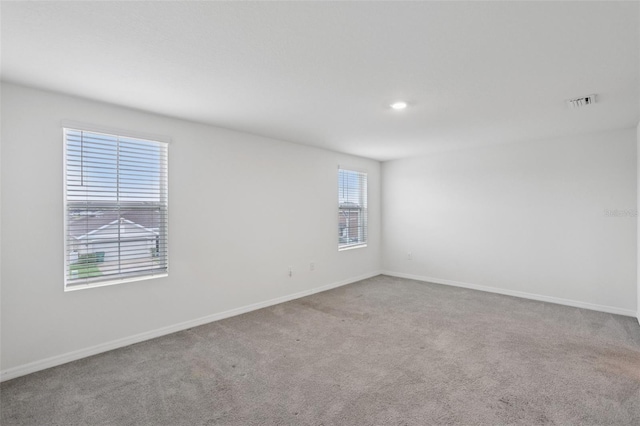 7530 Broad Pointe Dr, Zephyrhills, FL 33540 - empty room featuring carpet flooring and recessed lighting