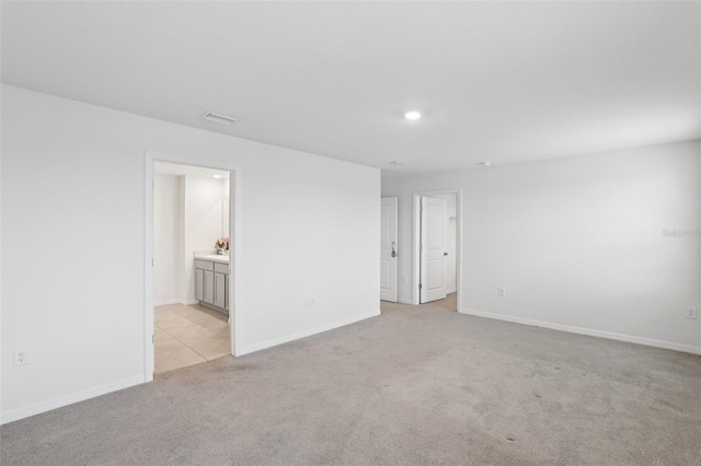 7530 Broad Pointe Dr, Zephyrhills, FL 33540 - spare room featuring light colored carpet and recessed lighting