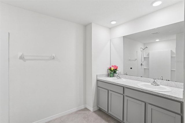 7530 Broad Pointe Dr, Zephyrhills, FL 33540 - full bathroom featuring double vanity, tile patterned floors, a shower, and recessed lighting
