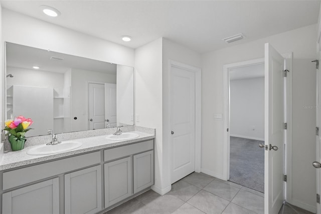 7530 Broad Pointe Dr, Zephyrhills, FL 33540 - full bath with double vanity and tile patterned floors